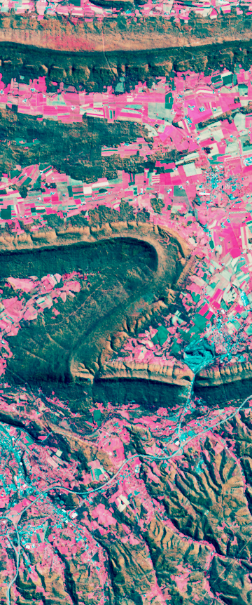 False-color Landsat satellite image showing a folded mountain ridge forming the number 2.
