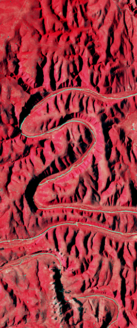 False-color Landsat satellite image showing a winding river canyon forming the number 2.