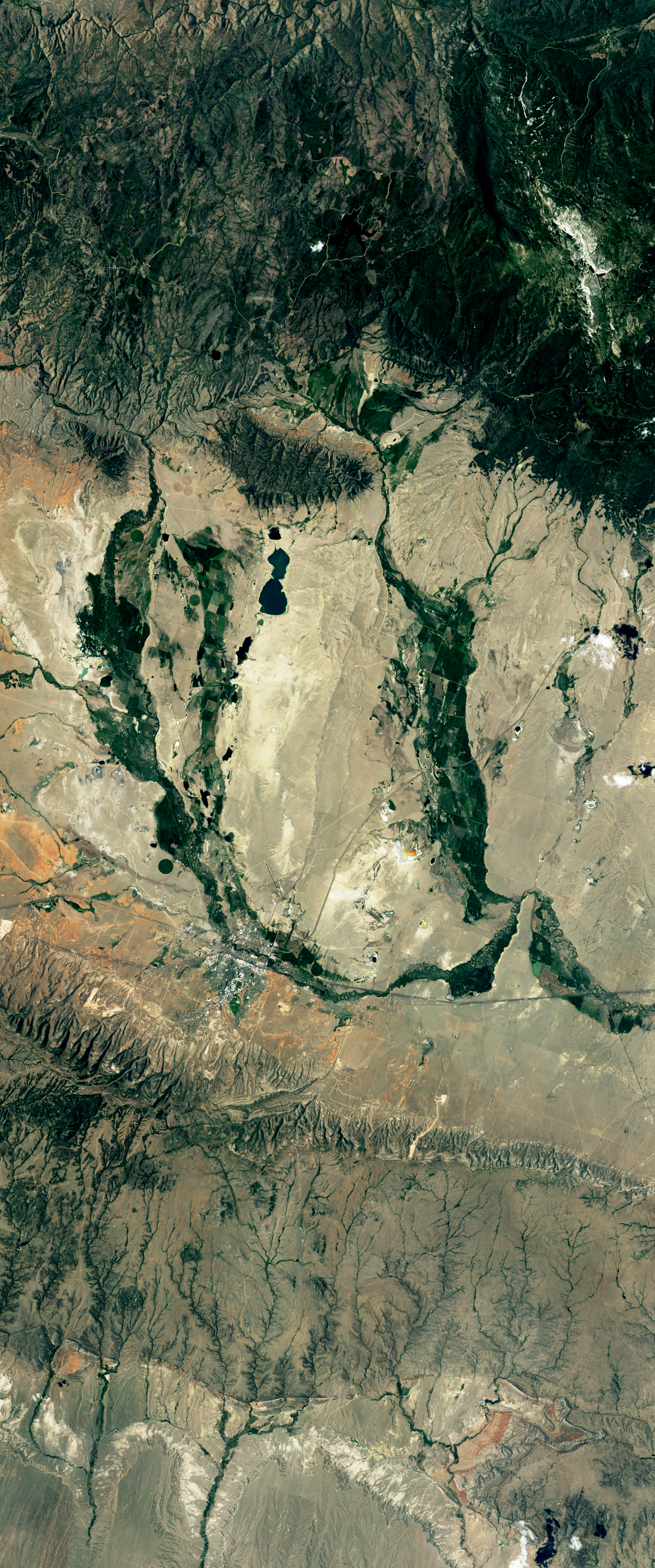 Landsat satellite image showing vegetated areas resembling the lower case letter U.