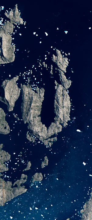 Landsat satellite image showing an island coastline forming the capital letter U surrounded by deep blue water.