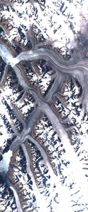 Channels in the land after a glacial retreat form the capital letter X in this Landsat satellite image.