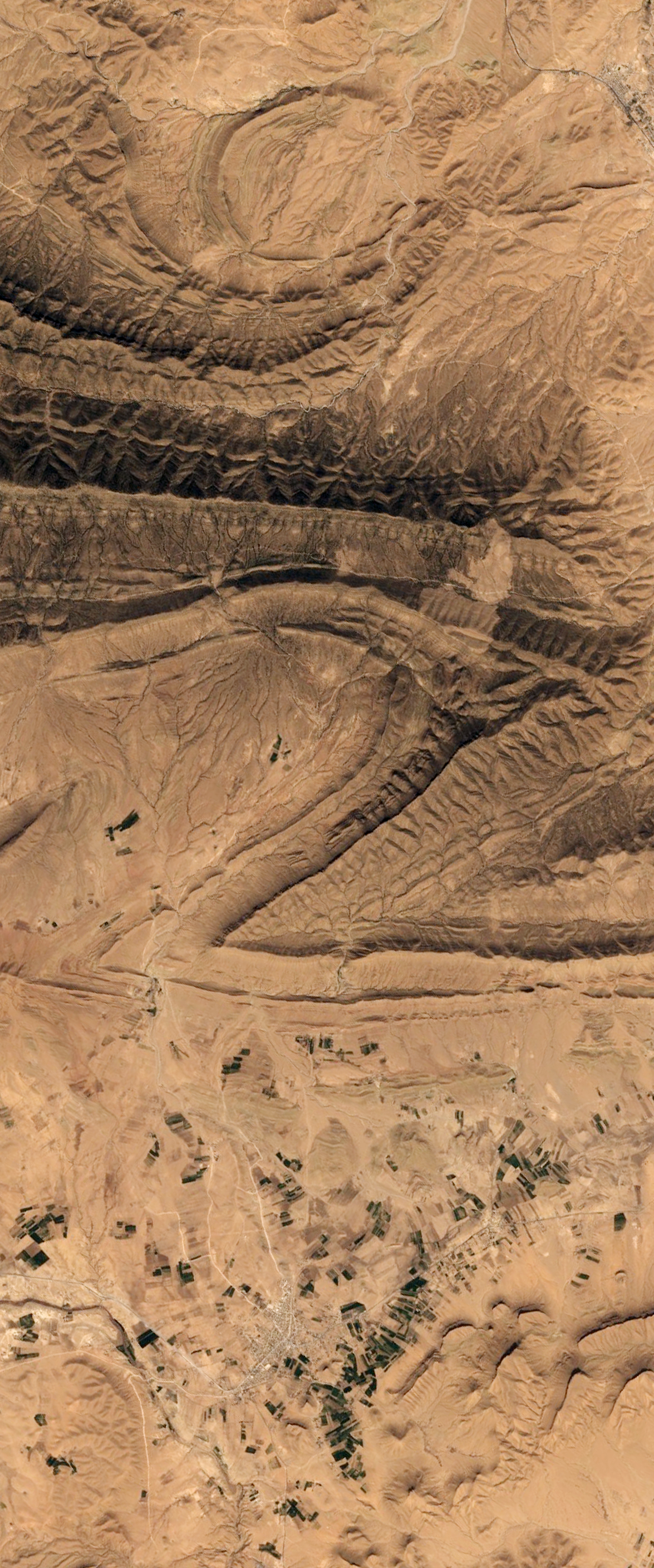 Landsat satellite image of a canyon in the form of the capital letter Z.