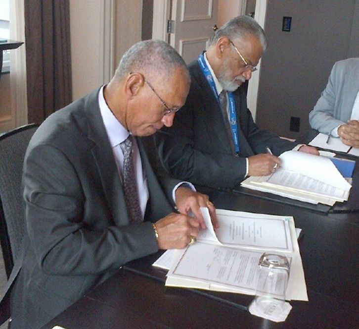 NASA Administrator Charles Bolden (left) and ISRO Chairman K. Radhakrishnan signing documents in Toronto on Sept. 30, 2014, to launch a joint Earth-observing satellite mission and establish a pathway for future joint missions to explore Mars. Credit: NASA