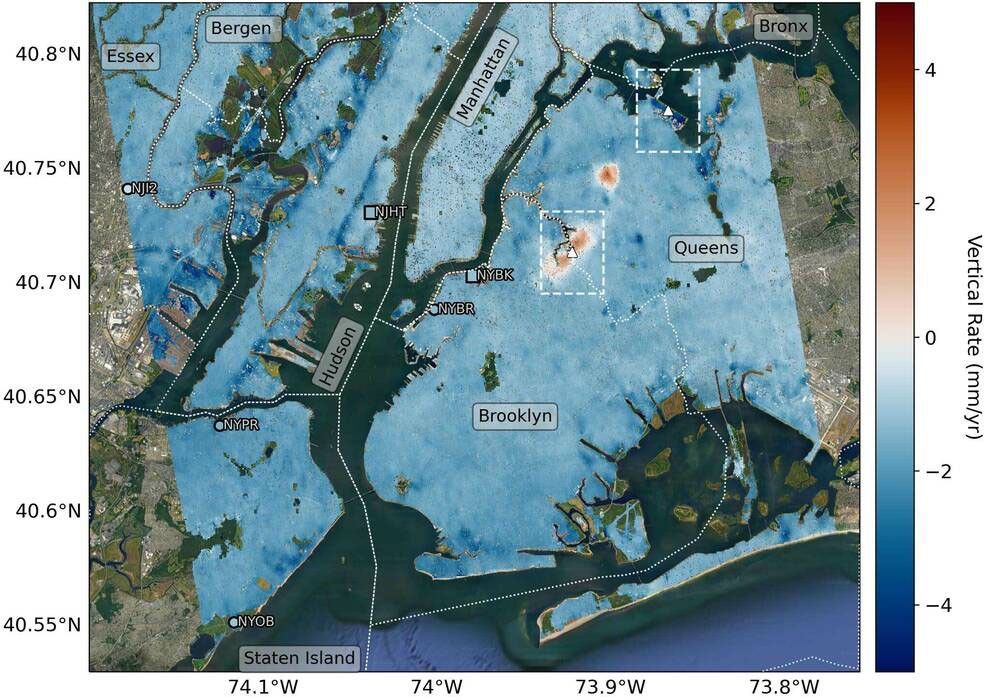 Mapping vertical land motion across the New York City area, researchers found the land sinking (indicated in blue) by about 0.06 inches (1.6 millimeters) per year on average. They also detected modest uplift (shown in red) in Queens and Brooklyn. White dotted lines indicate county/borough borders.