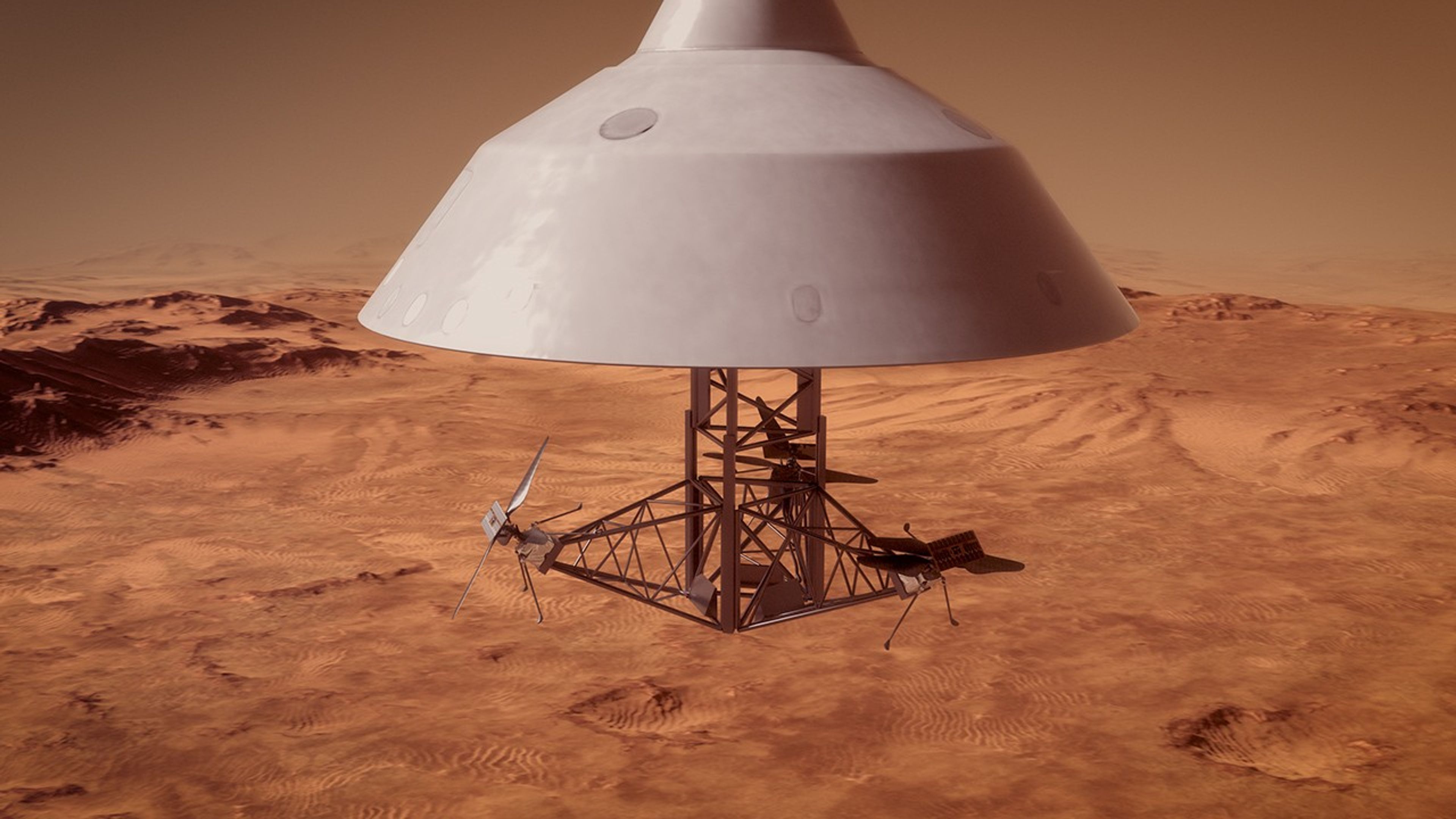 Artist's concept of a spacecraft descending toward a vast, reddish-brown Martian landscape characterized by sandy dunes and rocky hills. The spacecraft features a large, white, cone-shaped backshell at the top. Suspended directly beneath the backshell is an exposed, geometric metal truss structure. Securely attached to the outer arms of this central framework are three small SkyFall robotic helicopters. The helicopters are stowed with their landing legs extended but their rotor blades completely stationary, awaiting release.