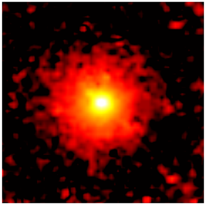 Against a black background is a red circle, which appears fuzzy and slightly pixelated. At the center is a bright area of yellow, and at the center of that is a bright area of white.