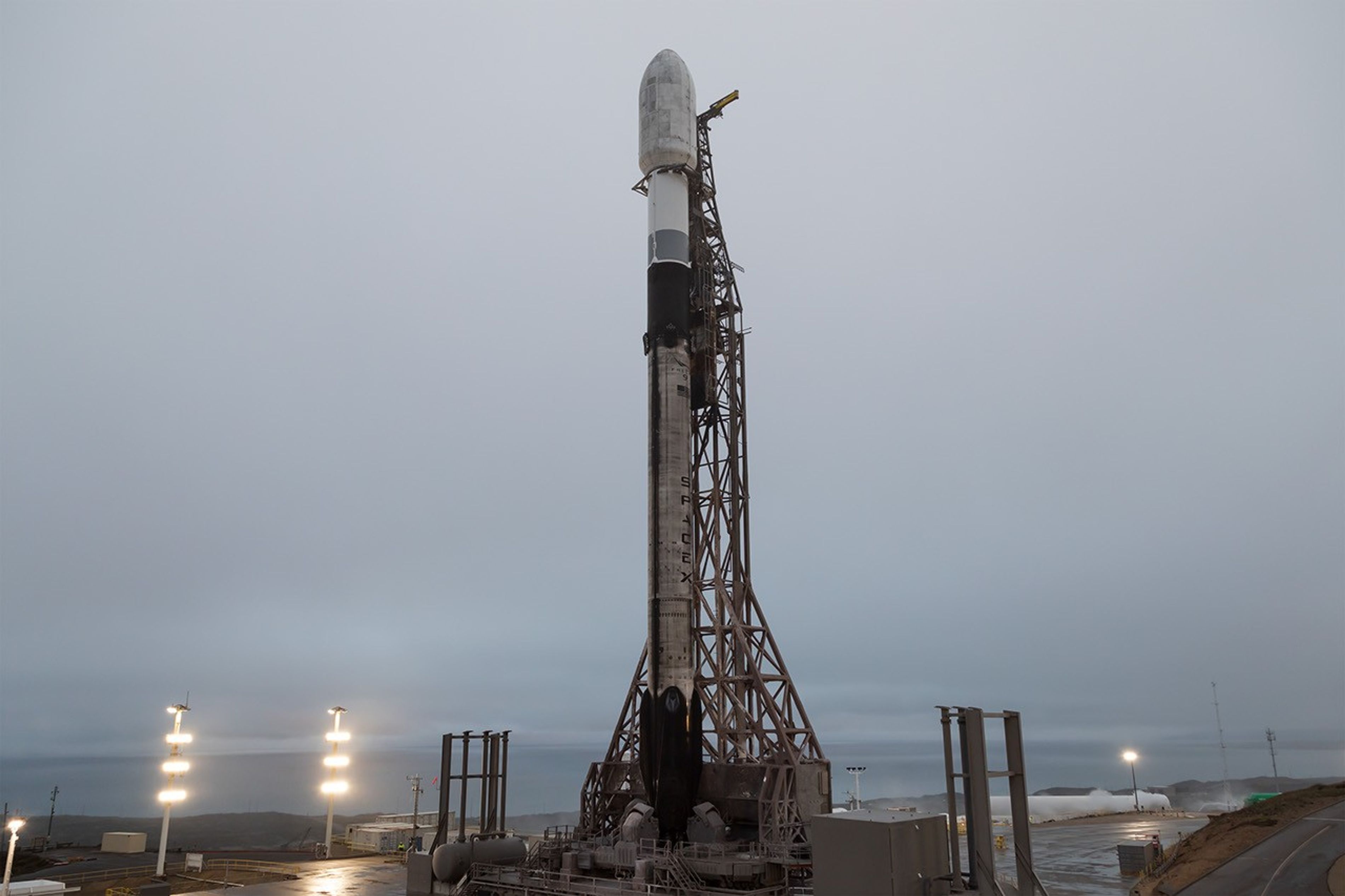 Image shows a SpaceX rocket at the launch pad with NASA payloads in California