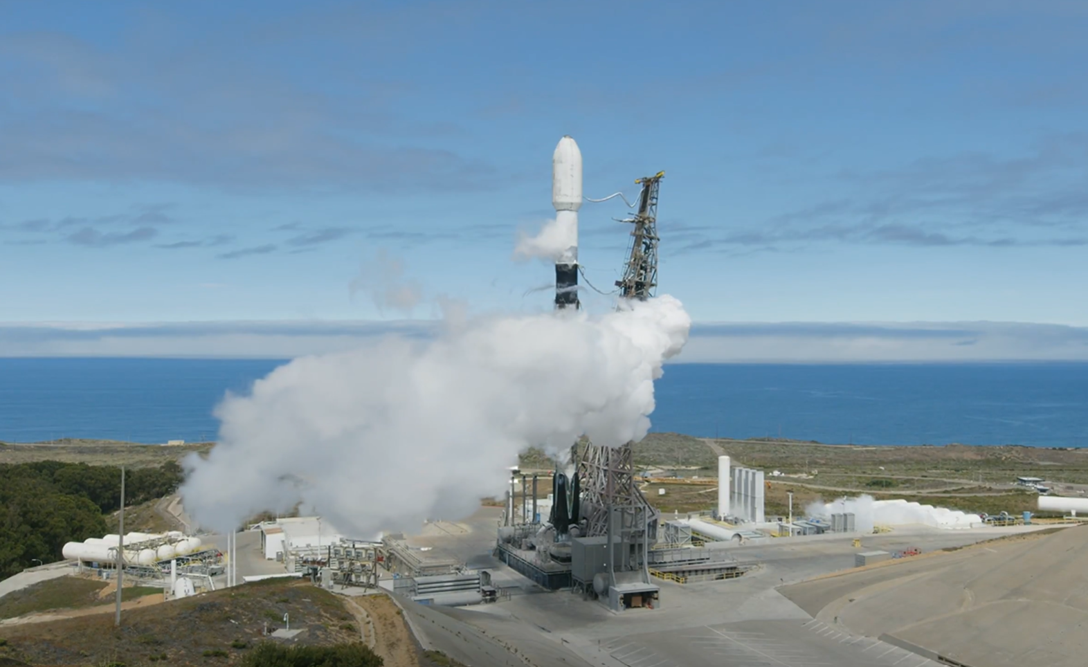 Image shows SpaceX rocket at the launch pad on a sunny day in California