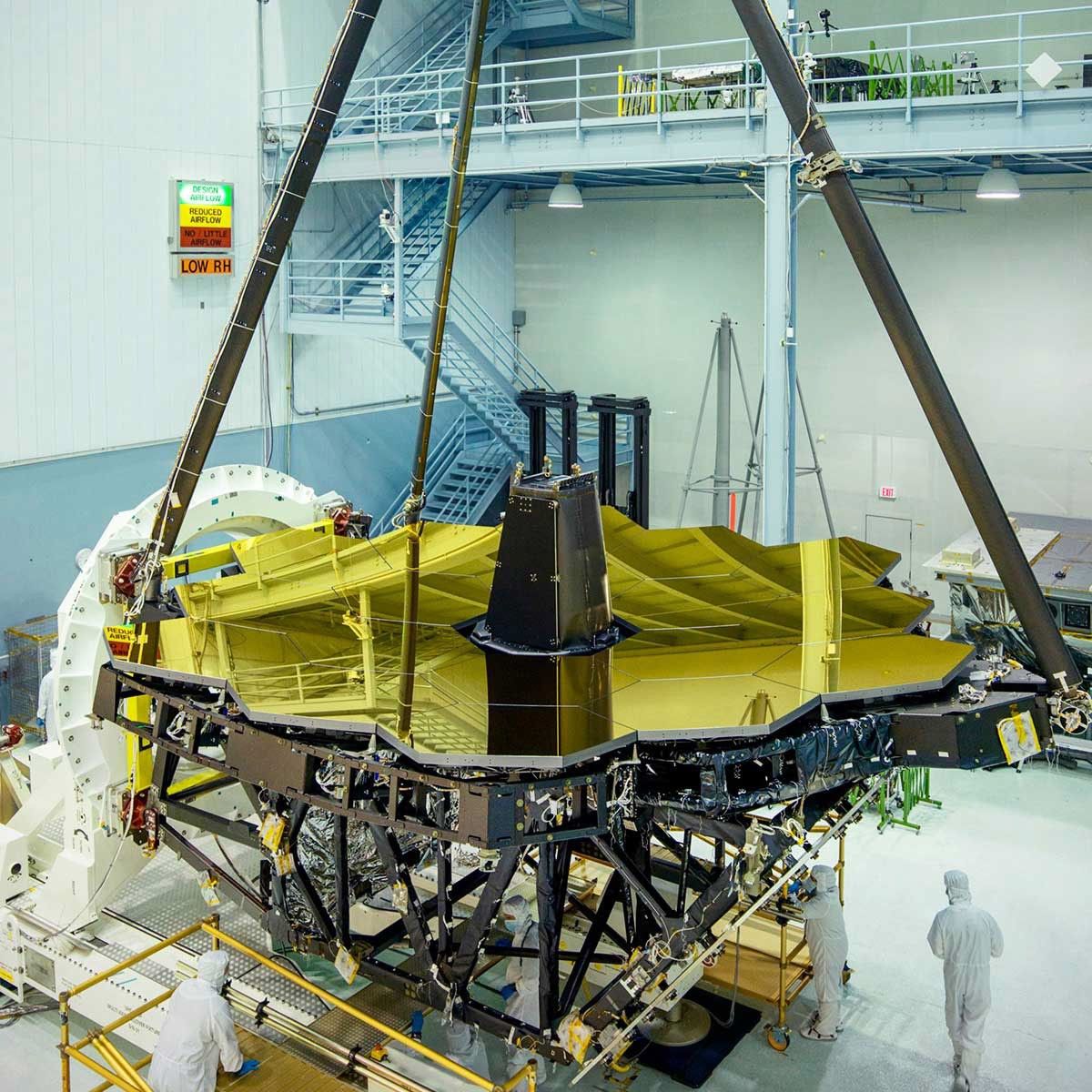 The gold-covered primary mirrors of the James Webb Space Telescope, revealed in the cleanroom at NASA Goddard