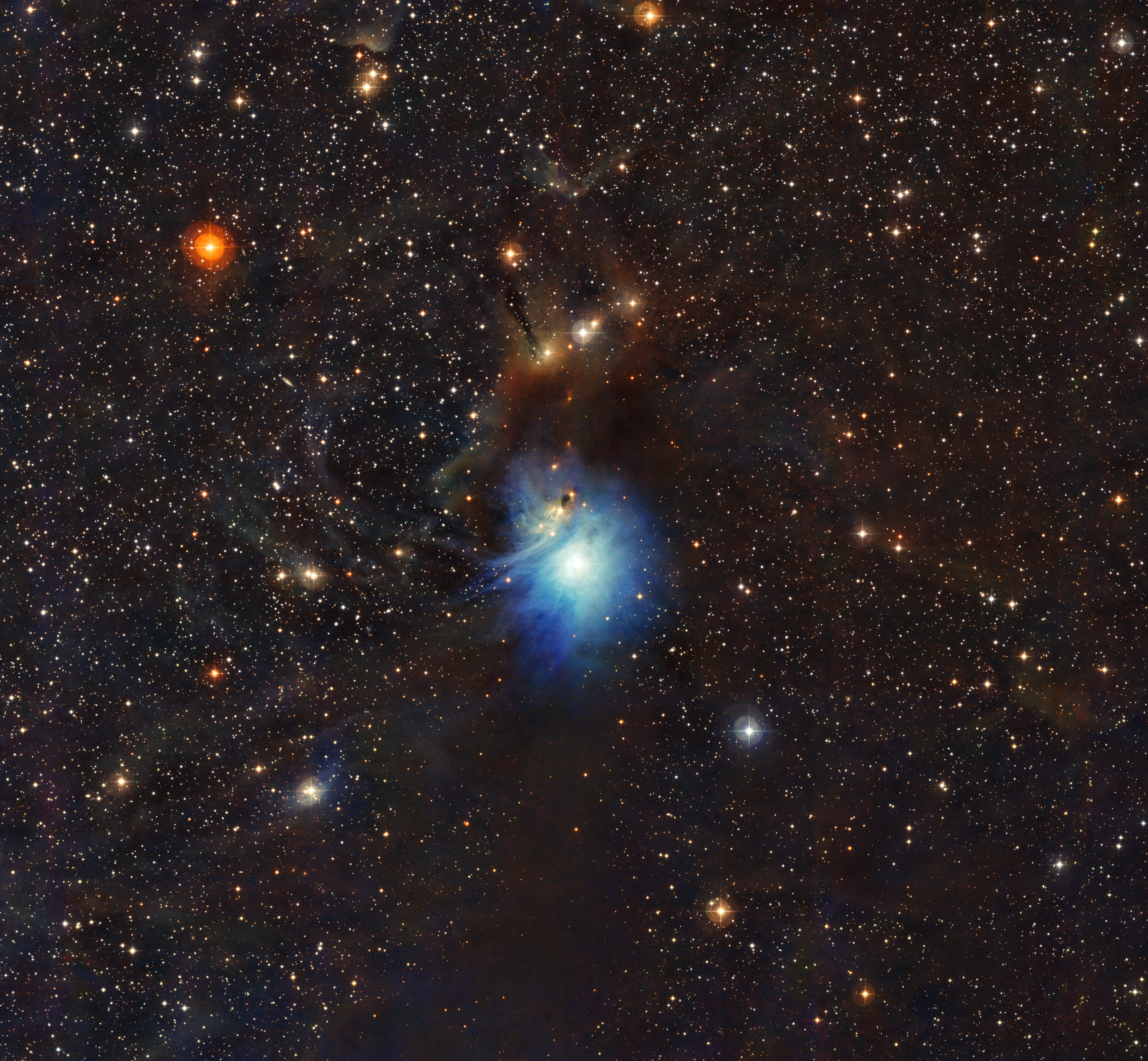 A wispy blue-white cloud on a background of stars.