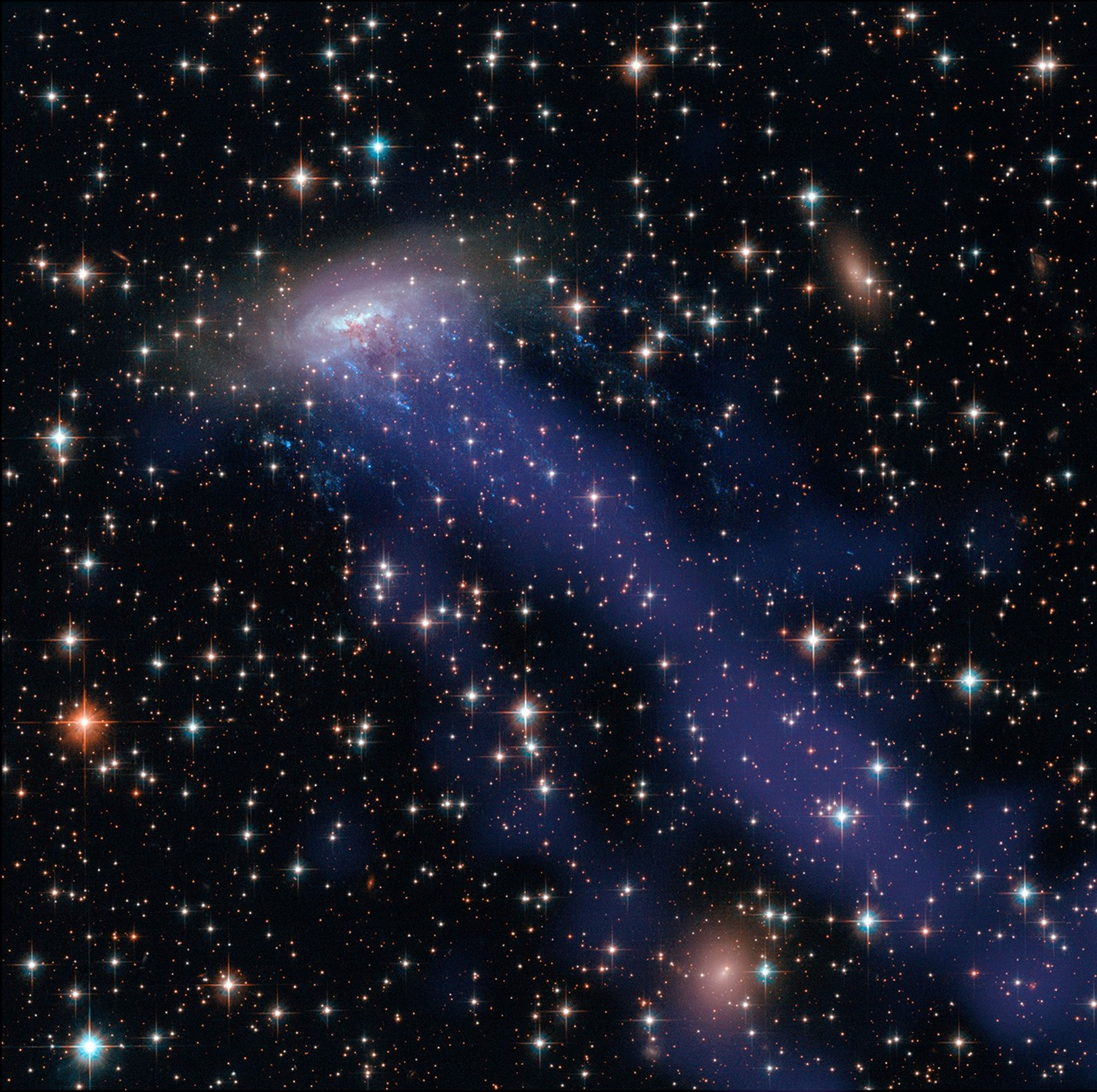 Spiral galaxy with a blue tail
