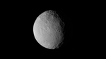 Dwarf planet Ceres takes up about one third of the view. It is gray and rocky, and appears against the black background of space. Ceres is lit by the Sun from the left side.