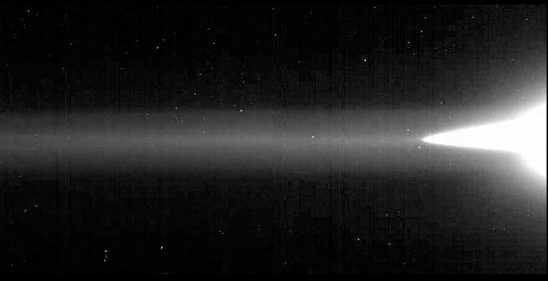 Grayscale image of Jupiter’s main ring and halo at right. Its gossamer ring extends fully to the left side as a horizontal, hazy band.