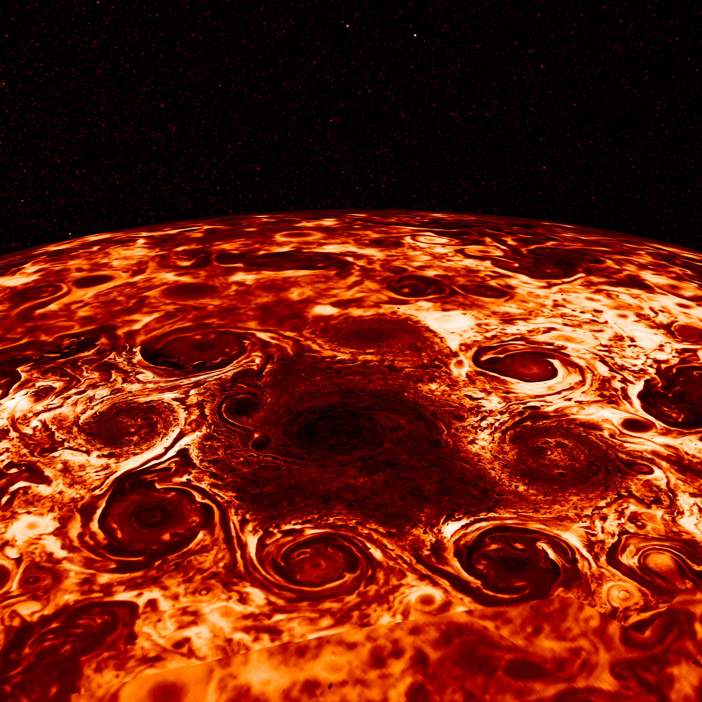 Tight view of Jupiter’s north pole shown in shades of dark red to bright white, featuring a large central cyclone encircled by eight cyclones.