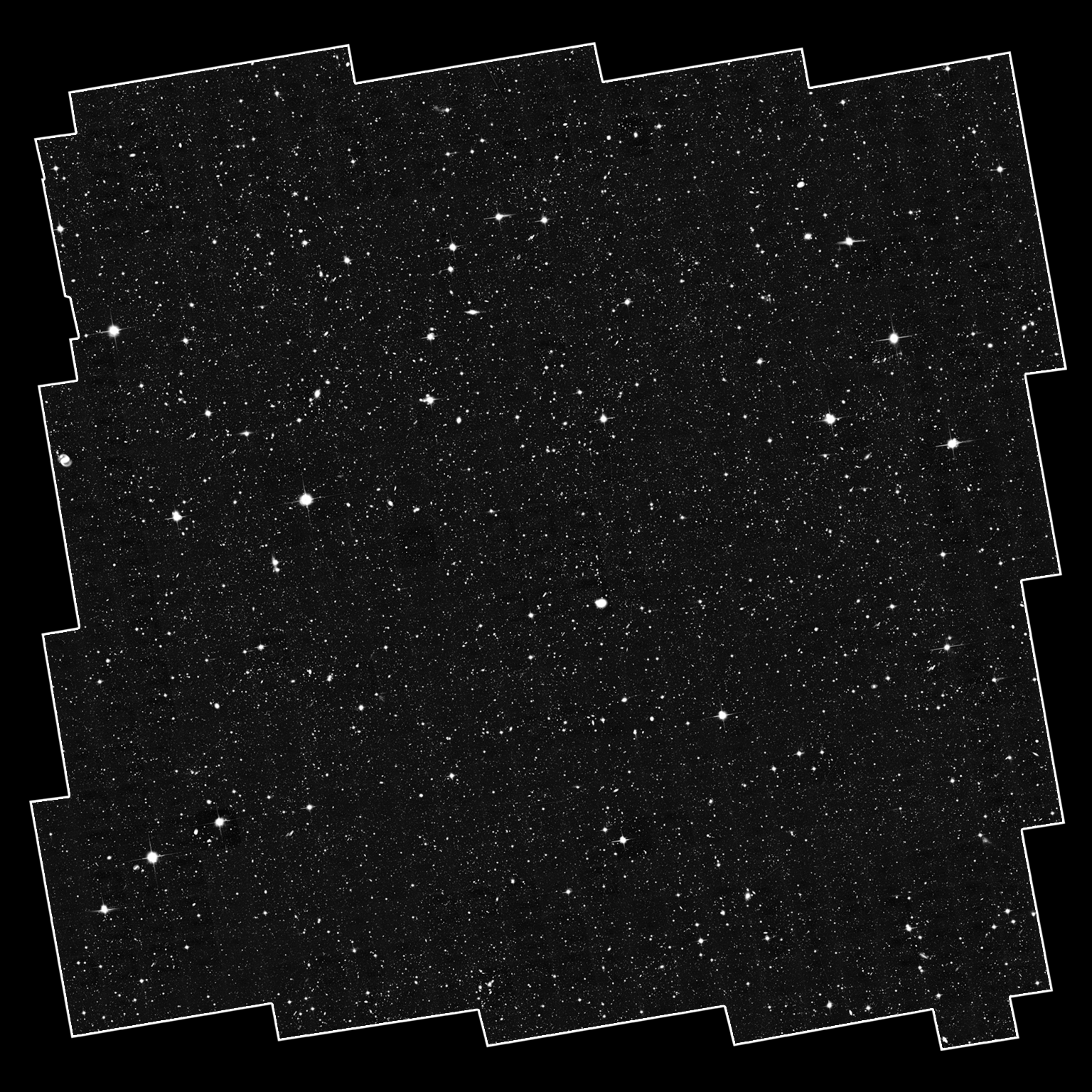 A white square with irregular, jagged edges falls just within the dimensions of the image. Within it is a grayscale field that shows hundreds of bright white points in a range of sizes.