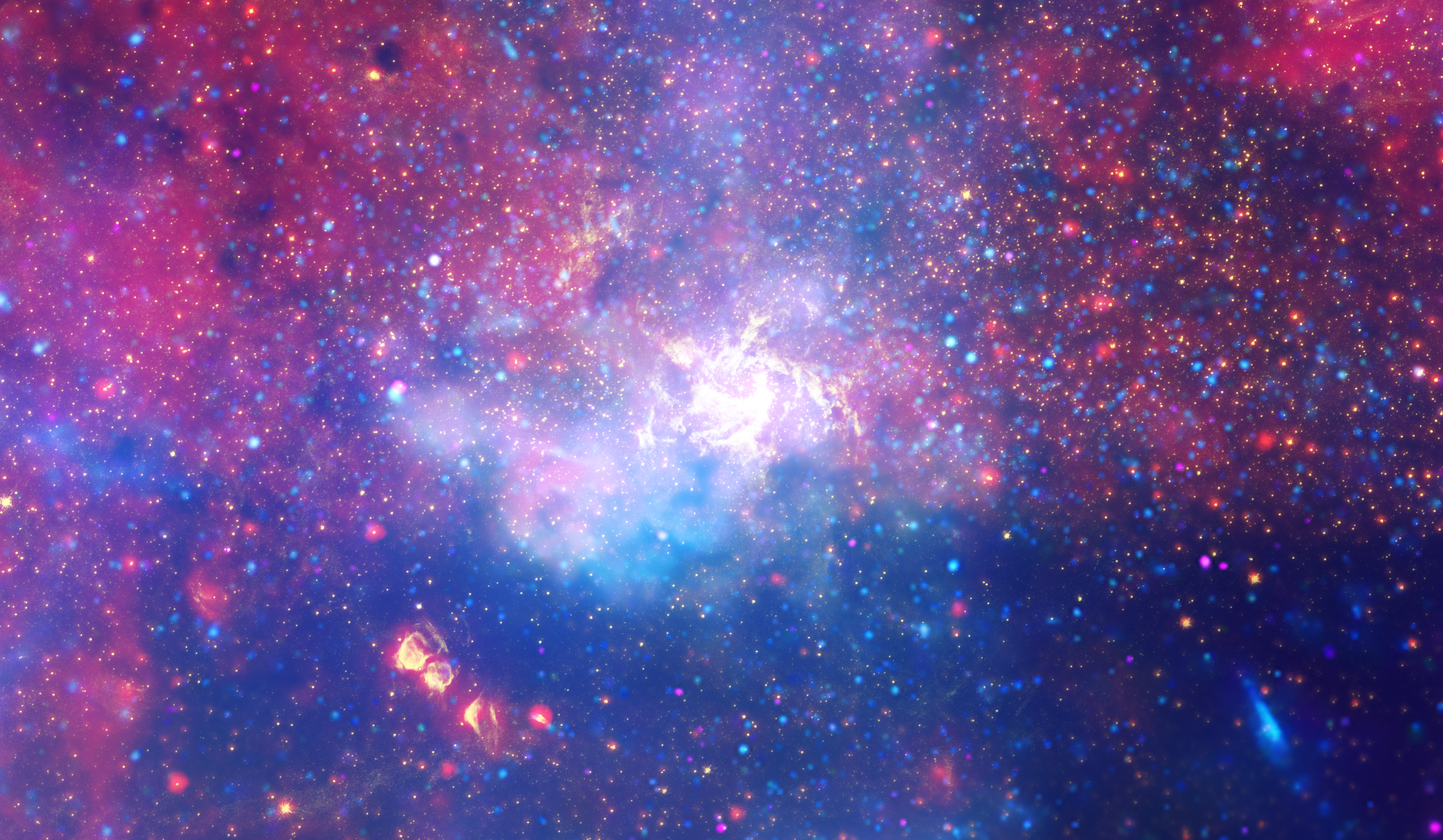 Telescope image with a background of blue, purple, red, yellow, and white clouds, a bright white center, and scattered spots of red and blue.