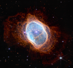Colorful image of near-infrared light from a glowing cloud with a distorted ring-like shape, illuminated from within by a bright central star.