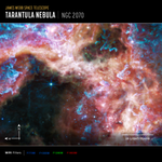 Image titled James Webb Space Telescope, Tarantula Nebula, NGC 2070. Graphic elements added to image are compass arrows, scale bar, and color key. Image shows wispy pale yellow nebula clouds highlighted with bright blue, purple and pink, surrounding a large black cavity. A few small blue stars are sprinkled at the right edge of the cavity and in the cloud. At the bottom left are compass arrows indicating the orientation of the image on the sky. The north arrow points straight up to 12 o'clock. The east arrow points straight left to 9 o’clock. At the lower right is a scale bar labeled 25 light-years. The length of the scale bar is about one-sixth the total width of the image. Below the image is a color key showing which MIRI filters were used to create the image and which visible-light color is assigned to each filter. From left to right, MIRI filters are: F770W is dark blue, F1000W is light blue, F1280W is green, F1800W is red.