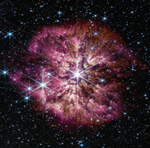 A large, bright star shines from the center with smaller stars scattered throughout the image. A clumpy cloud of material surrounds the central star, with more material above and below than on the sides, in some places allowing background stars to peek through. The cloud material is yellow closer to the star, and turns purple at its outer edges.