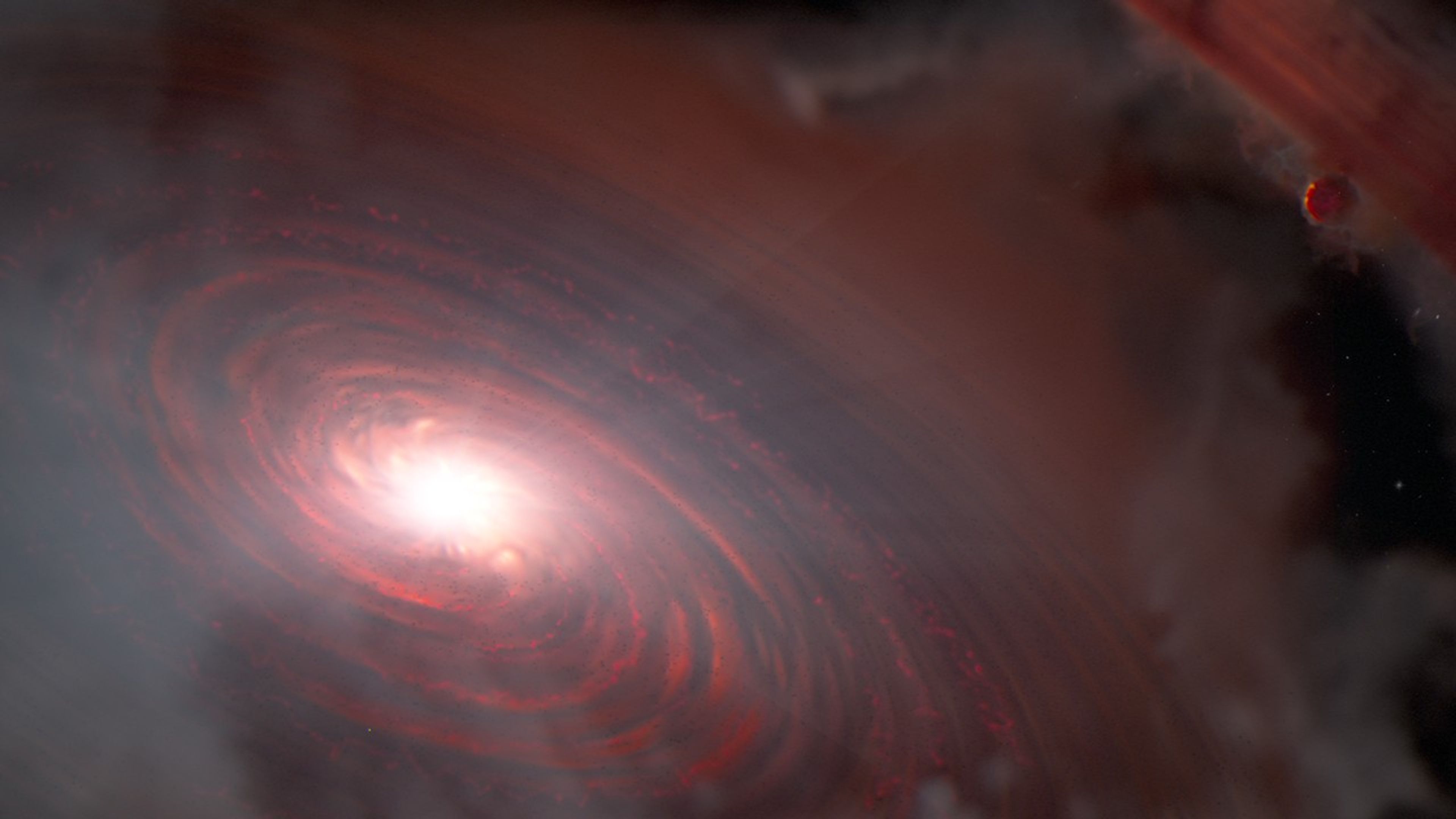 Left of center, a bright light source illuminates a surrounding disk colored dusky red. The disk is tilted from upper left to lower right, and has spiral features that are most prominent near the star. Small, rocky objects are scattered throughout the inner disk. At upper right, there is a gap through which background stars can be seen. At the outer edge of this gap is a dusky globe representing a gas giant planet. Beyond it, in the top right corner, is additional outer disk material, some of which is falling onto the planet.