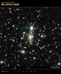 Image titled “James Webb Space Telescope; WHL J013719.8-082841” with compass arrows, scale bar, and color key. In the center is a near-infrared image of a field of galaxies with one very bright star. At the lower left are compass arrows indicating the orientation of the image on the sky. The east arrow points toward 7 o’clock. The north arrow points toward 11 o’clock. At the bottom right is a scale bar labeled 30 arcseconds. The length of the scale bar is about one tenth of the total image. Below the image is a color key showing which NIRCam filters were used to create the image and which visible-light color is assigned to each filter. NIRCam filters from left to right: F090W, F115W, and F150W are blue; F200W is cyan, F277W is green; F356W is yellow, F410M is orange, and F444W is red.