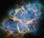 The Crab Nebula. A multicolored oval with complex structure extends from lower left to upper right against a black background.