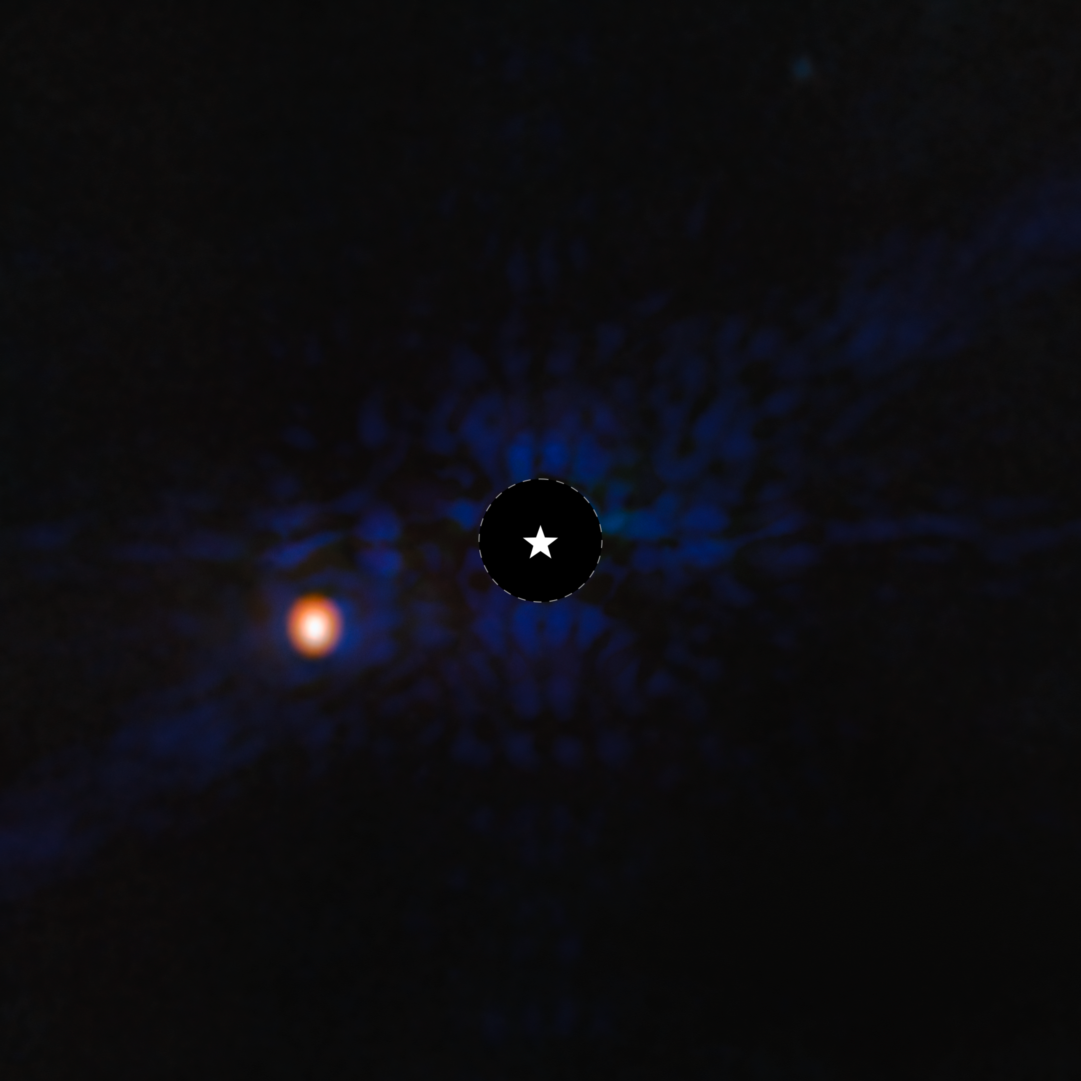 This image shows the exoplanet Epsilon Indi Ab. The image is mostly black, with blue scale-like features apparent in the central region of the image. At the center of the image, there is a black circle, and in the center, a symbol representing a star. This black circle blocks the light from the host star. To the lower left of the circle is a fuzzy bright orange circle, which is the exoplanet.