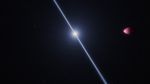 Against a black background, a white beam emanates diagonally, oriented from 11 ou2019clock to 5 ou2019clock, from either side of a small, glowing, white star. To the right of this star, a partially illuminated, lemon-shaped exoplanet appears. This planet is most brightly illuminated at its elongated tip on its left side. The planetu2019s right side, which is wider, appears to trail off into the darkness of the background. The planet is colored in varying, mottled shades of red, light pink, and fuchsia. Most of the pink occurs closest to the tip, while most of the fuchsia is at the top and bottom edges.