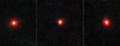 Three side-by-side Webb images of little red dots. Each little red dot is centered within a square frame and lies against the black background of space. Each dot has a yellow-white circular core surrounded by a red, fuzzy ring.