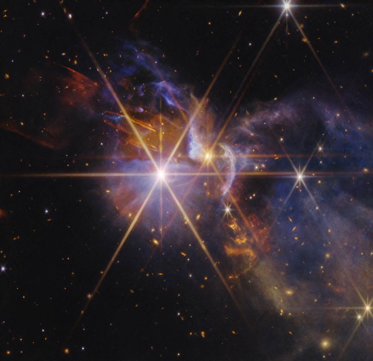 NASA Webb image of FS Tau star-forming region with colorful gas and protostars