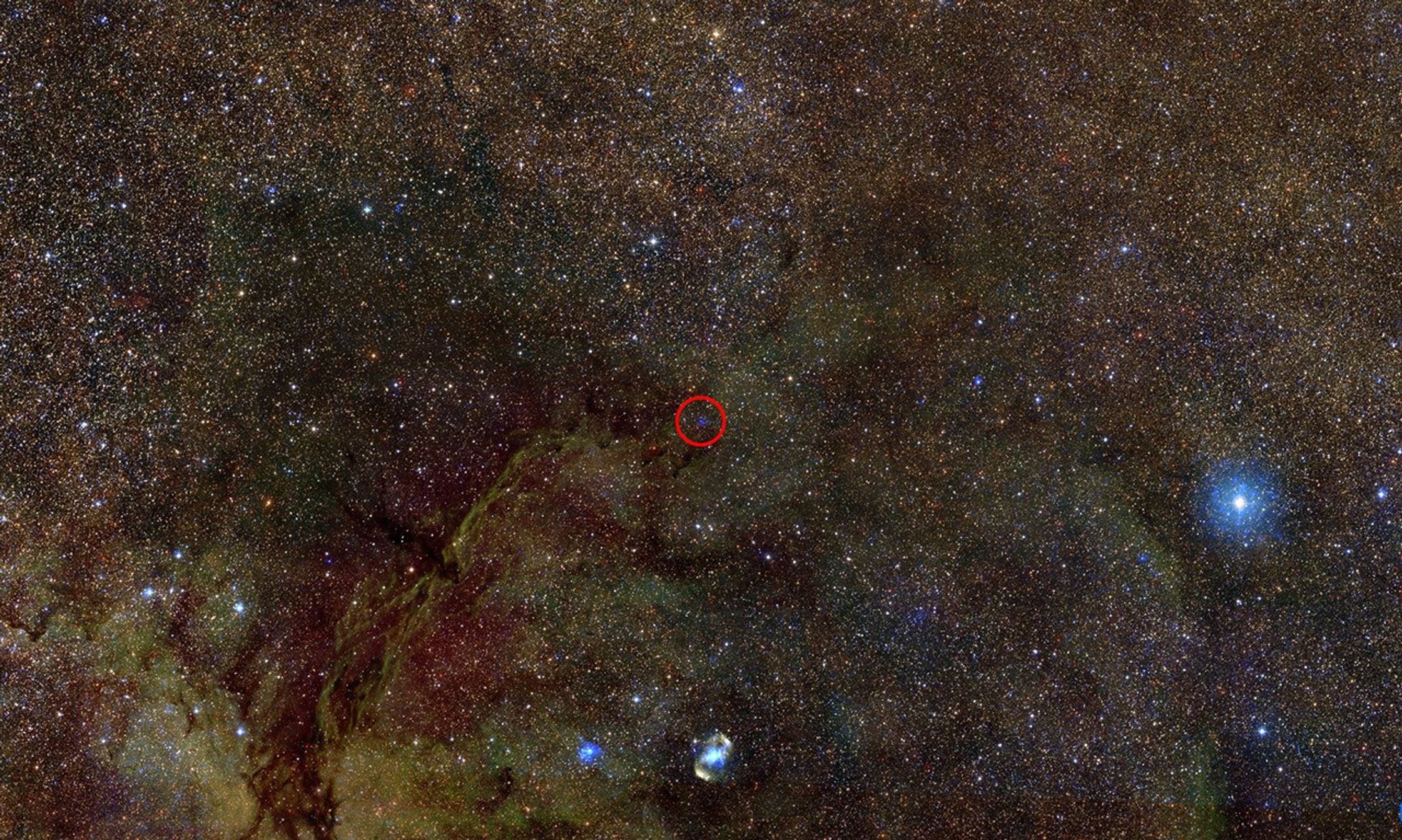 Optical, infrared, and X-ray composite image of a portion of the interstellar gas and dust