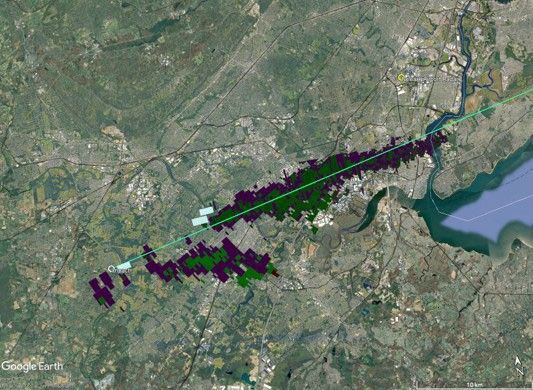 Satellite map of the Hillsborough, New Jersey, area with the meteorite's projected flight path shown as a green diagonal line extending from southwest to northeast. Colored radar detections along and below the flight path indicate where falling meteorite fragments were detected as winds carried them east-northeast during their descent. The figure illustrates how radar observations helped scientists reconstruct the meteorite's fall.