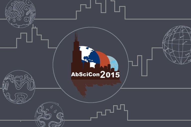 The logo appears as a skyline image of Chicago with the tallest building to the left in maroon. The buildings are reflected below at an angle as if in water and a washed out, lighter color. AbSciCon 2015 is in white across the base of the buildings. Behind the buildings from left to right and in descending size are the Earth (Blue with white continents - the Americas showing), Mars (red/orange), and Enceladus (light blue with darker blue 'cracks' on the surface). They are drawn as simple vector shapes. The logo is enclosed in a white circle on a grey background. White lines trace across the background and zigzag in parts resembling skylines. Superimposed on the lines in places are the white map outlines of planets and their surfaces. This represents spectra from extrasolar planets.