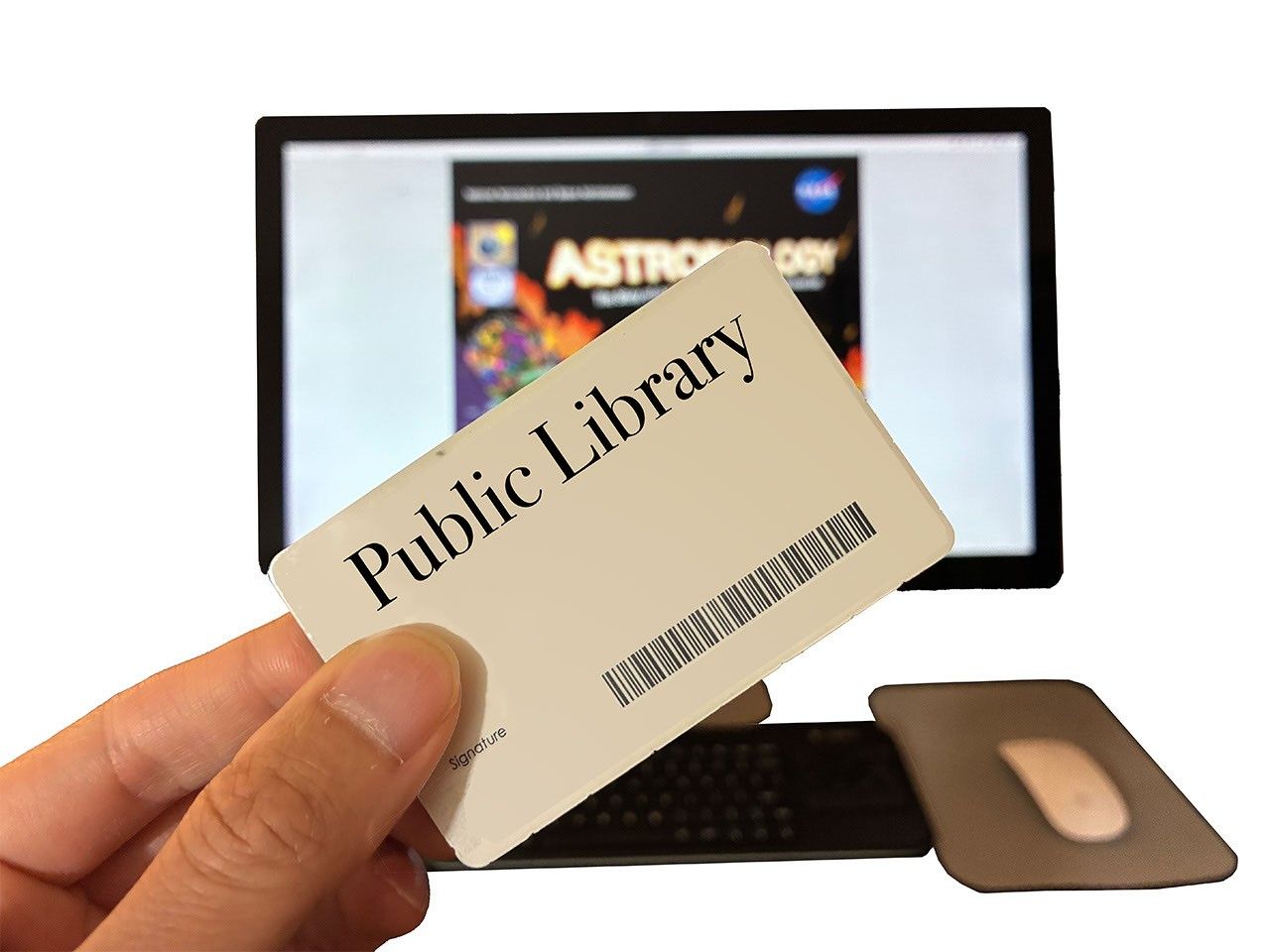 A hand holding a library card over a computer monitor displaying the Astrobiology Graphic Histories book.