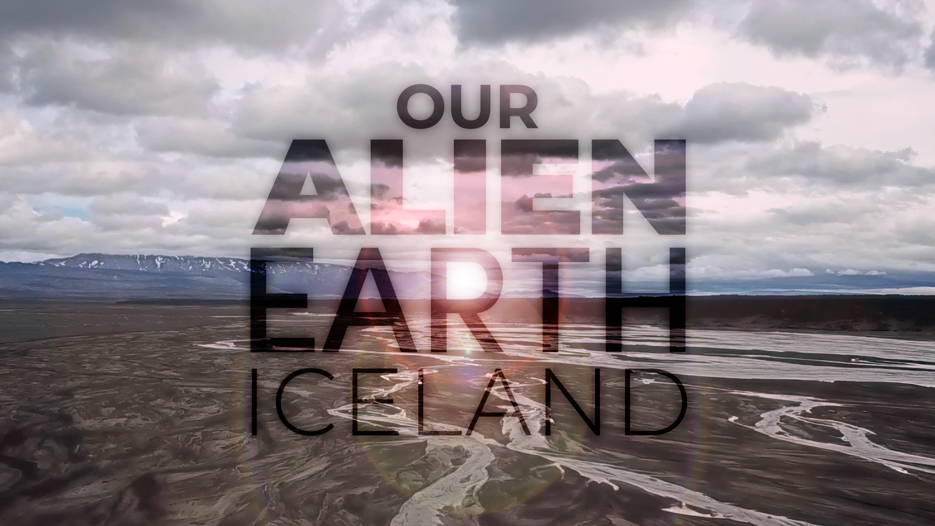 Title image for episode 1 of Our Alien Earth, depicting an aerial view of a flooded plain of volcanic rock in Iceland
