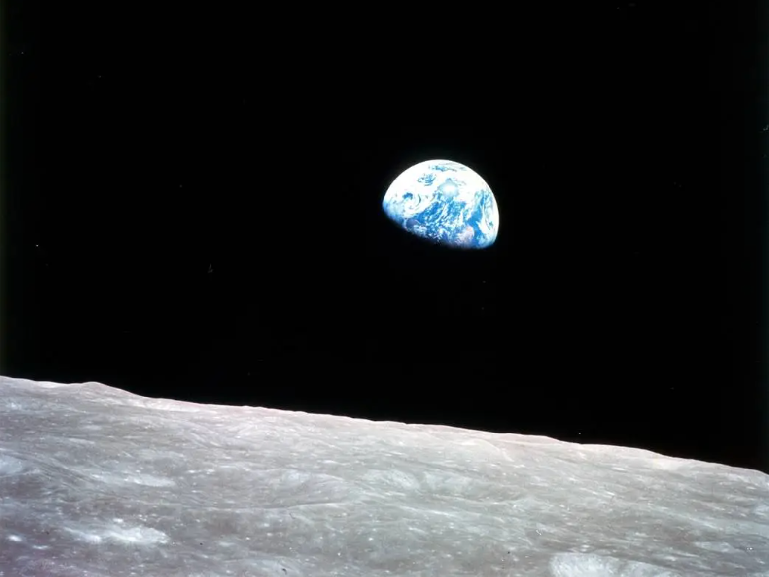 Earthrise photographed by Apollo 8 astronaut William Anders in December 1968 — the blue and white Earth rising above the grey lunar surface