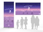 Silhouettes of people in grey stand in front of2 display banners with artwork.