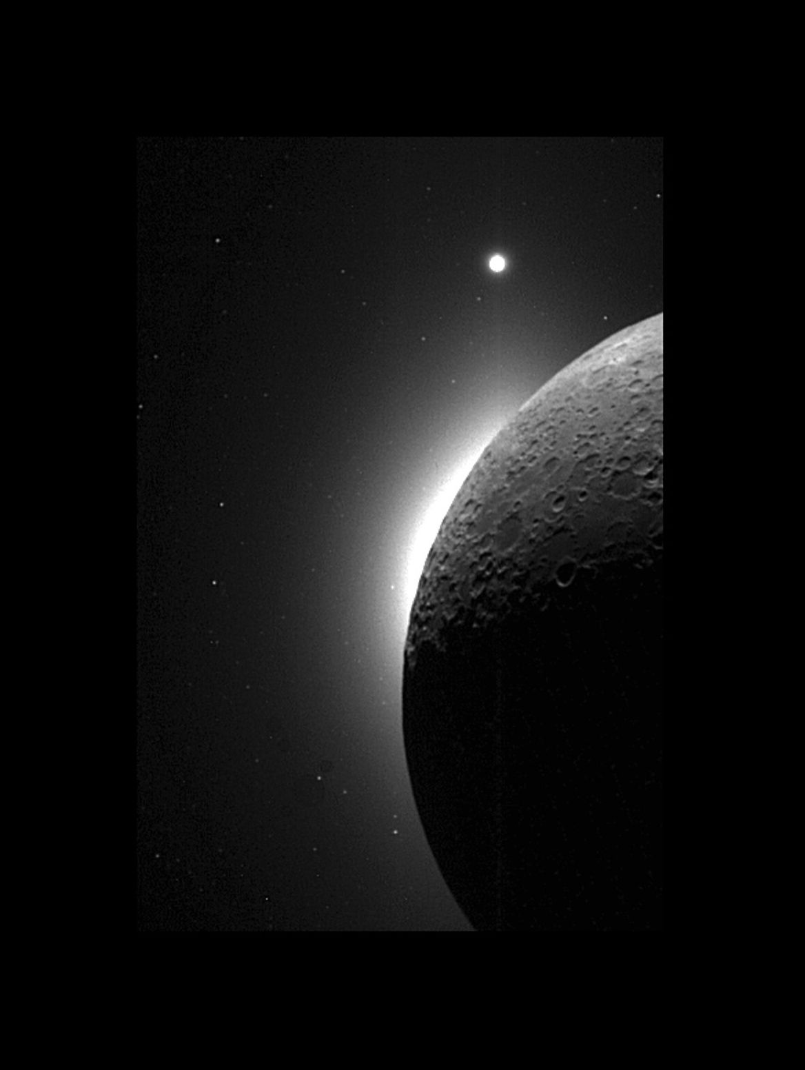The Moon, gently illuminated by light reflected from Earth