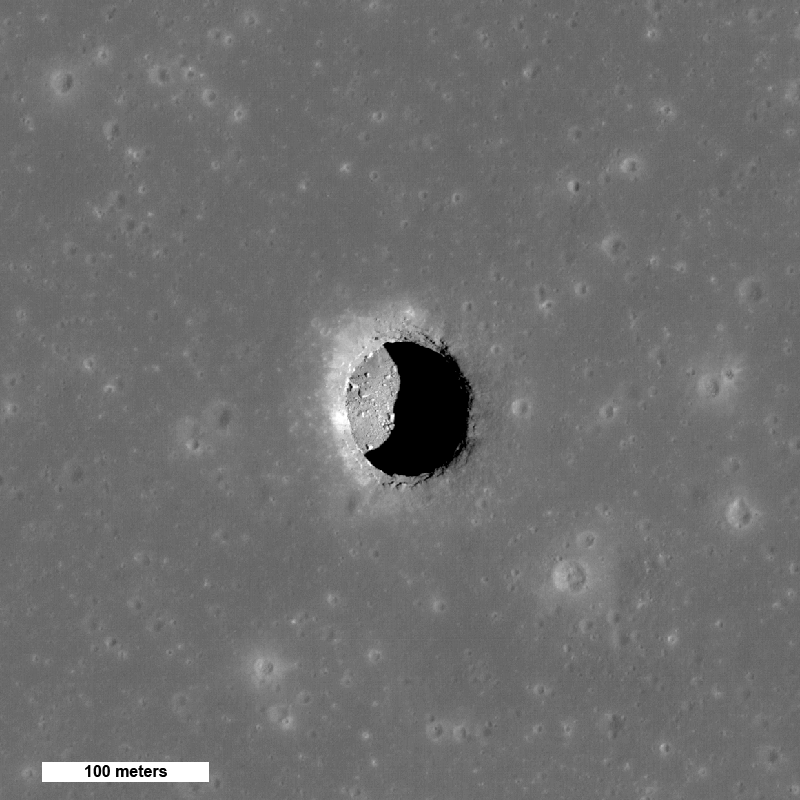a collapse pit in an otherwise smooth gray surface