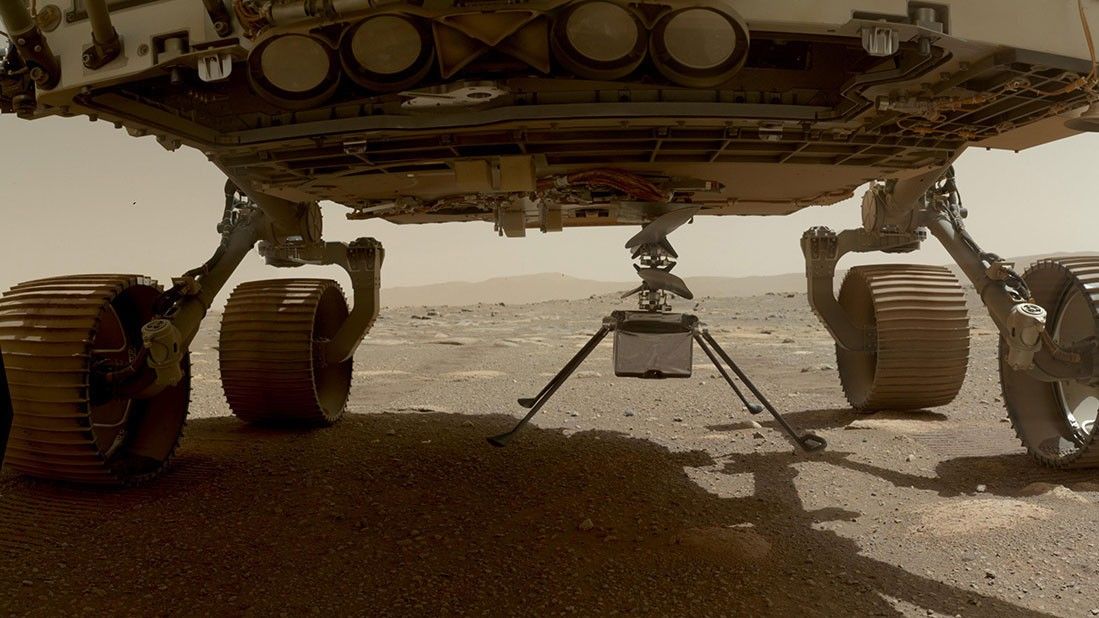 NASA's Ingenuity helicopter can be seen here with all four of its legs deployed before dropping from the belly of the Perseverance rover