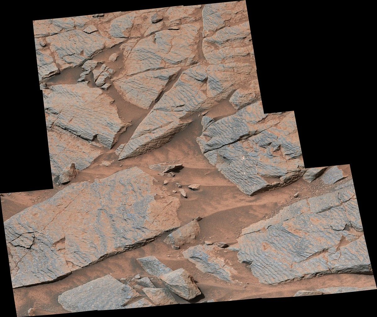 NASA’s Curiosity rover captured this image of rhythmic rock layers with a repetitive pattern in their spacing and thickness.
