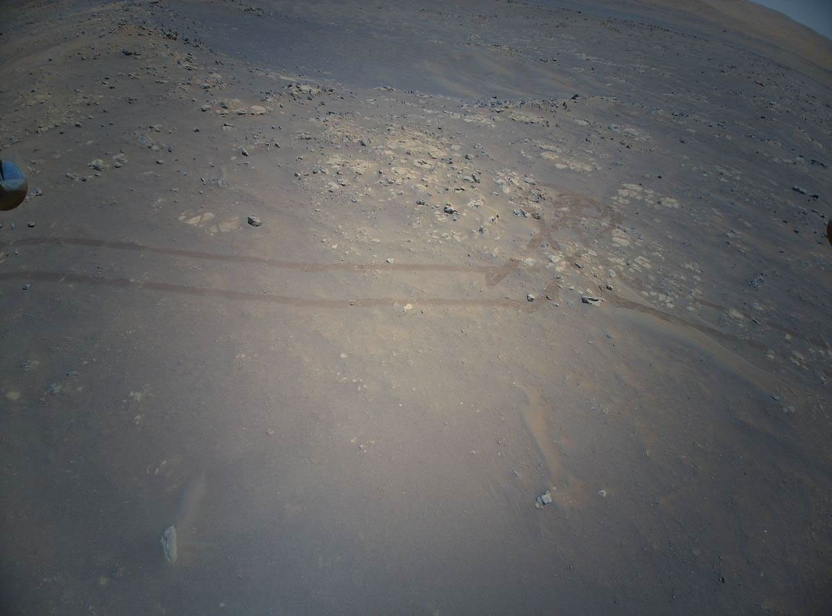 NASA's Ingenuity Mars Helicopter acquired this image using its high-resolution color camera. This camera is mounted in the helicopter's fuselage and pointed approximately 22 degrees below the horizon.