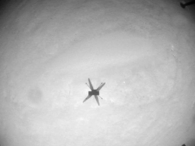 NASA's Ingenuity Mars Helicopter acquired this image using its navigation camera. This camera is mounted in the helicopter's fuselage and pointed directly downward to track the ground during flight.