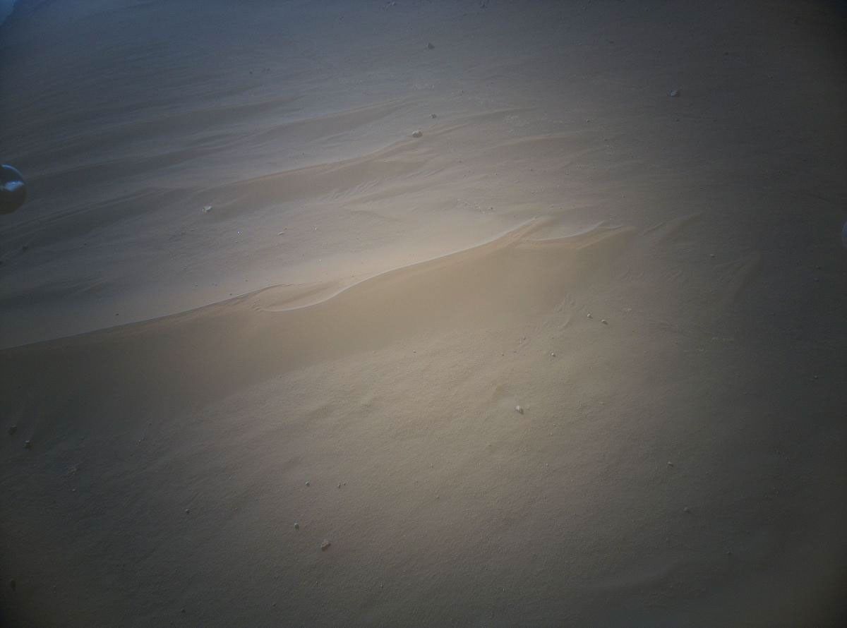 NASA's Ingenuity Mars Helicopter acquired this image using its high-resolution color camera. This camera is mounted in the helicopter's fuselage and pointed approximately 22 degrees below the horizon.