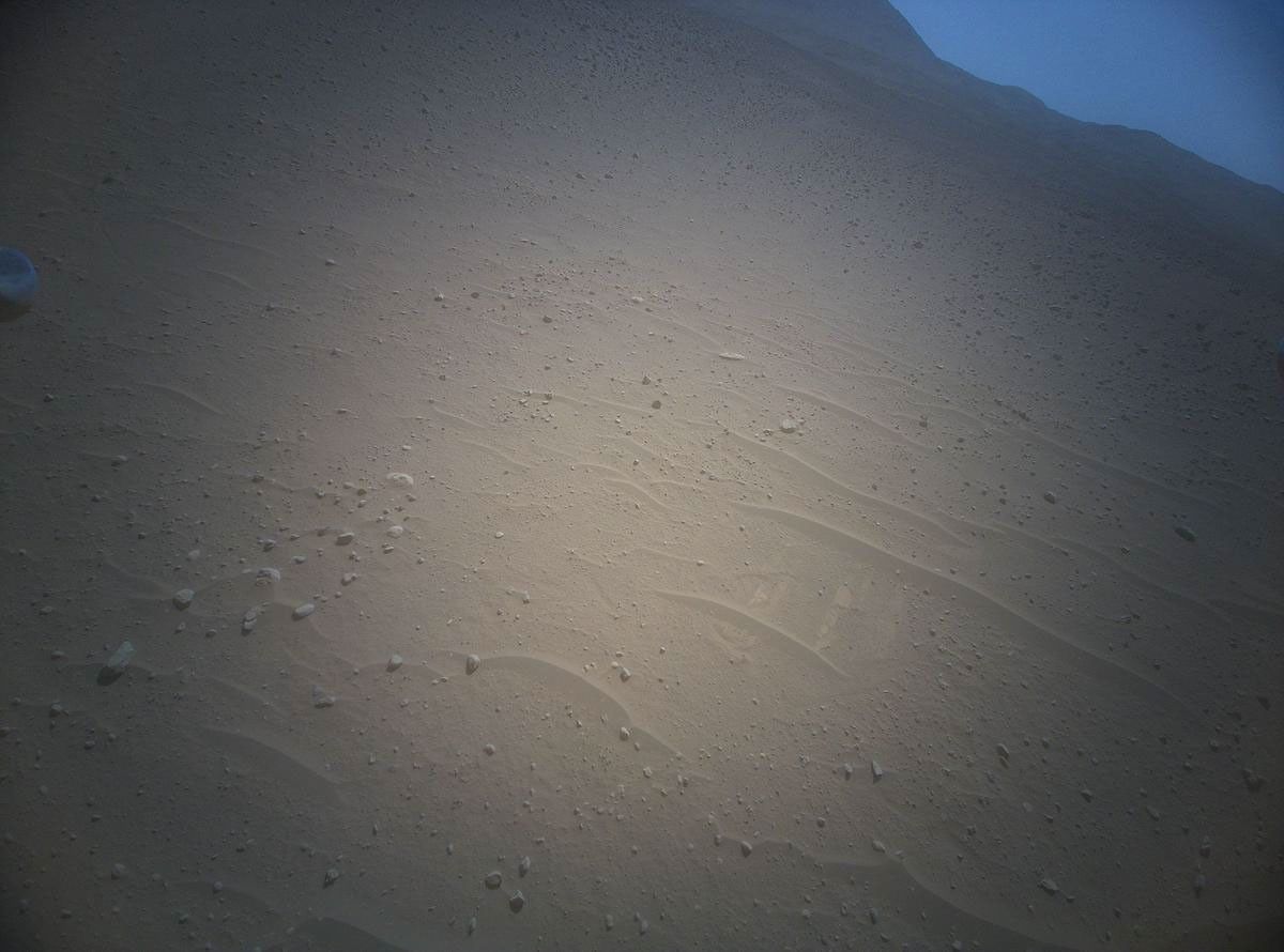NASA's Ingenuity Mars Helicopter acquired this image using its high-resolution color camera. This camera is mounted in the helicopter's fuselage and pointed approximately 22 degrees below the horizon.