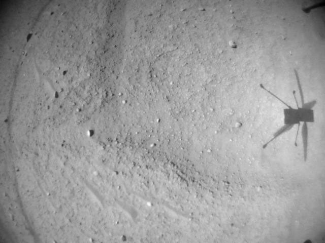 NASA's Ingenuity Mars Helicopter acquired this image using its navigation camera. This camera is mounted in the helicopter's fuselage and pointed directly downward to track the ground during flight.