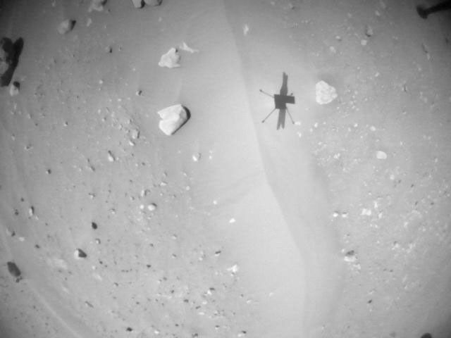 NASA's Ingenuity Mars Helicopter acquired this image using its navigation camera. This camera is mounted in the helicopter's fuselage and pointed directly downward to track the ground during flight.