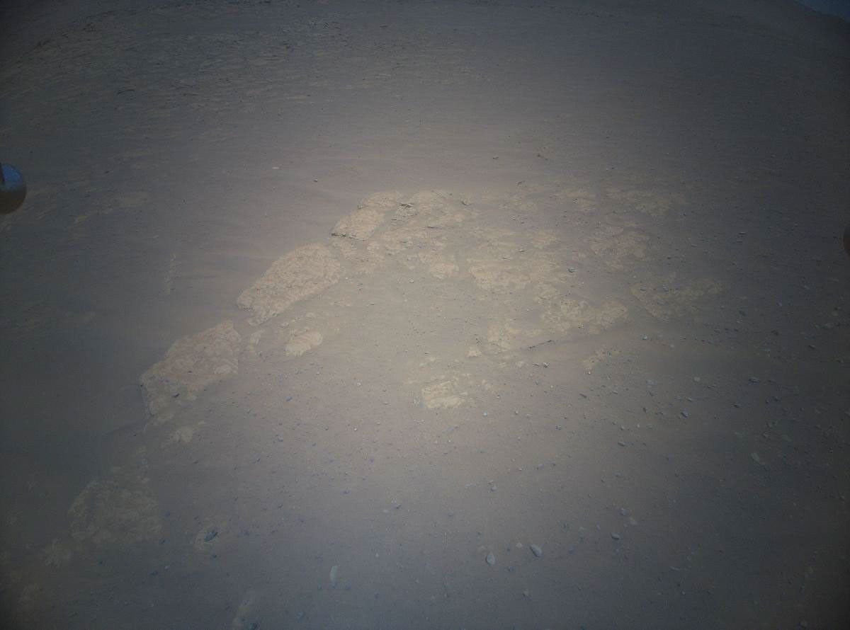 NASA's Ingenuity Mars Helicopter acquired this image using its high-resolution color camera. This camera is mounted in the helicopter's fuselage and pointed approximately 22 degrees below the horizon.