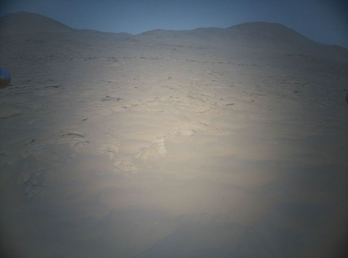 NASA's Ingenuity Mars Helicopter acquired this image using its high-resolution color camera. This camera is mounted in the helicopter's fuselage and pointed approximately 22 degrees below the horizon.