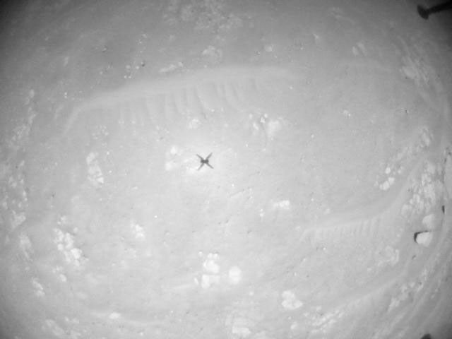 NASA's Ingenuity Mars Helicopter acquired this image using its navigation camera. This camera is mounted in the helicopter's fuselage and pointed directly downward to track the ground during flight.